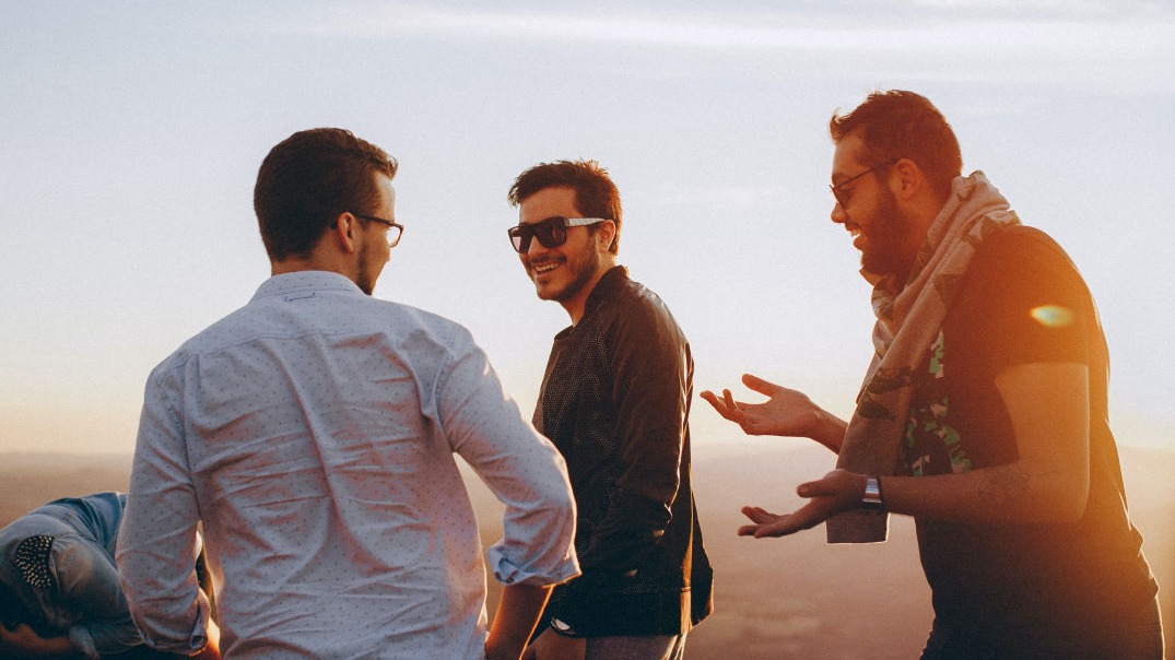 Young men chatting.